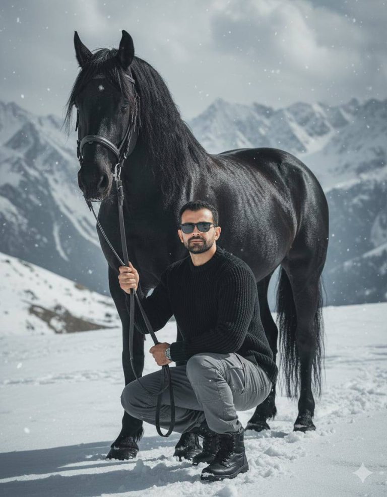 Man Kneeling With Black Horse In Snowy Mountains